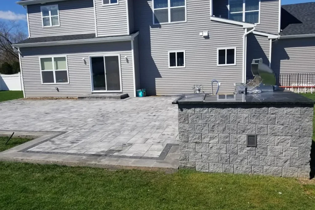 Custom natural stone veneer retaining wall and steps